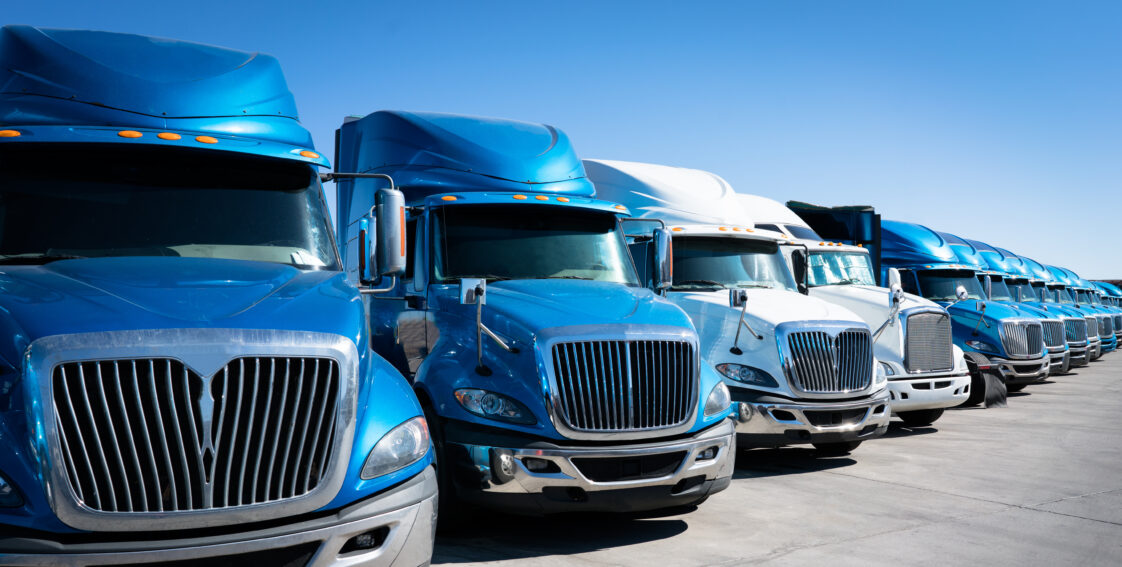 Fleet of semi trucks lined up together