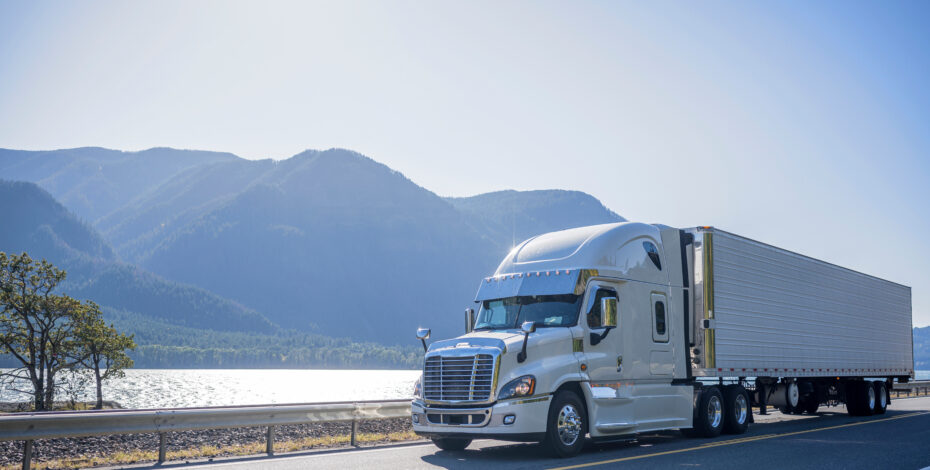 Semi Truck on Road with Mountain Background