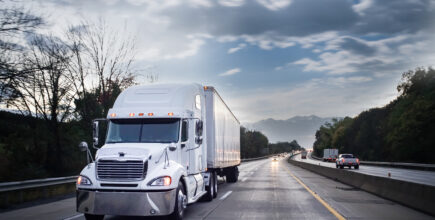 White 18 wheeler truck on highway